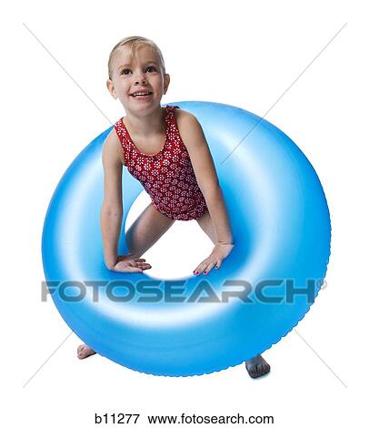 Young girl with inflatable ring View Large Photo Image Stock Photo - Young girl with inflatable ring. Fotosearch