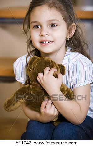 Young girl with teddy bear View Large Photo Image Stock Image - Young girl with teddy bear. Fotosearch