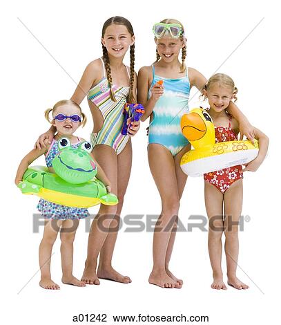 Young sisters in swimsuits on vacation View Large Photo Image Stock Image - Young sisters in swimsuits on vacation. Fotosearch
