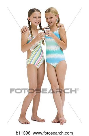 Young sisters in swimsuits on vacation View Large Photo Image Stock Photograph - Young sisters in swimsuits on vacation. Fotosearch