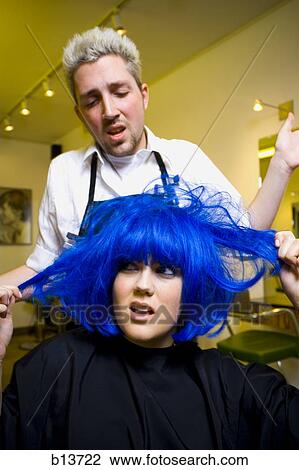 Young woman at hair salon with blue hair View Large Photo Image Stock Image - Young woman at hair salon with blue hair. Fotosearch