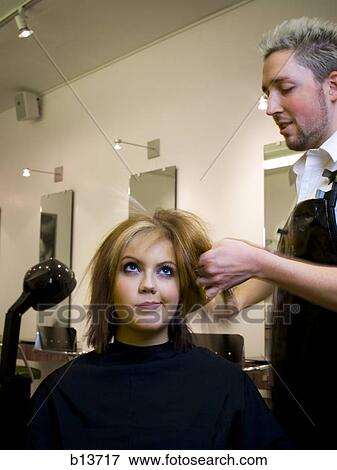 Young woman at hair salon with hairdresser View Large Photo Image Stock Photo - Young woman at hair salon with hairdresser. Fotosearch