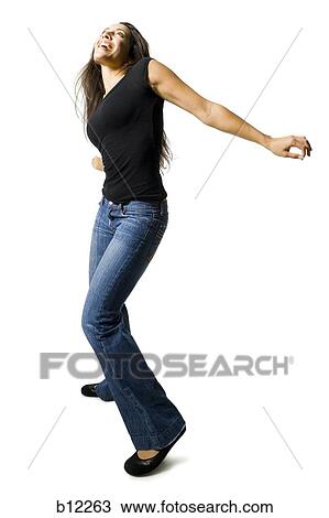 Stock Image - Young woman dancing. Fotosearch