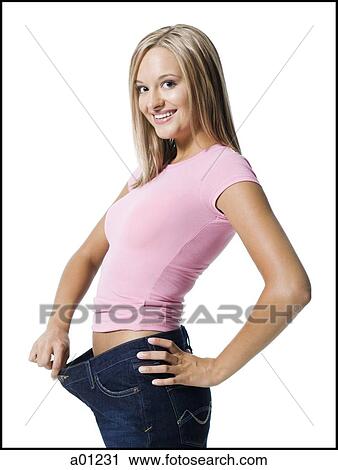 Young woman excited about weight loss View Large Photo Image Stock Image - Young woman excited about weight loss. Fotosearch