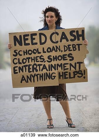 Young woman holding a help-needed sign View Large Photo Image Stock Photo - Young woman holding a help-needed sign. Fotosearch