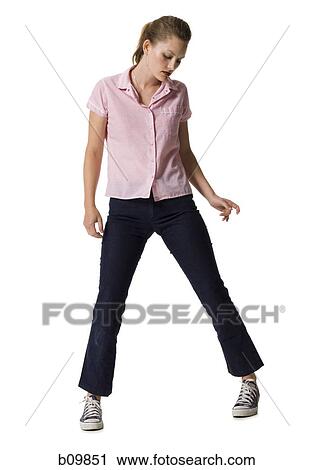 Young woman standing and posing View Large Photo Image Stock Image - Young woman standing and posing. Fotosearch