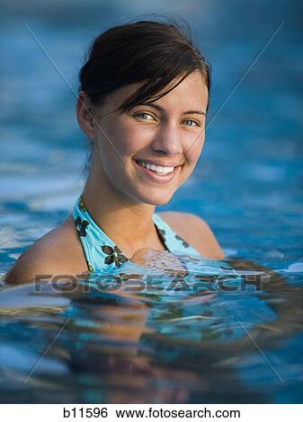 Young woman swimming View Large Photo Image Stock Photograph - Young woman swimming. Fotosearch