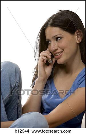Young woman with cell phone View Large Photo Image Picture - Young woman with cell phone. Fotosearch
