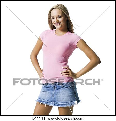 Young woman with hands on hips View Large Photo Image Stock Image - Young woman with hands on hips. Fotosearch