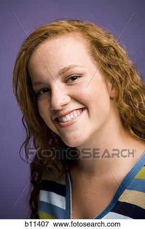 Young woman with red hair View Large Photo Image Stock Photo - Young woman with red hair. Fotosearch
