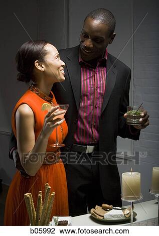 A couple at a party View Large Photo Image Stock Image - A couple at a party. Fotosearch