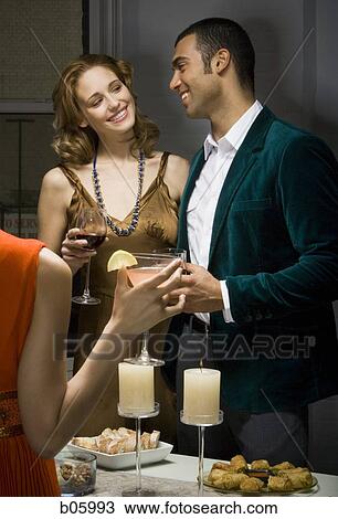 A couple at a party View Large Photo Image Stock Image - A couple at a party. Fotosearch
