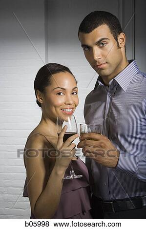 Stock Photo - A couple at a party. Fotosearch