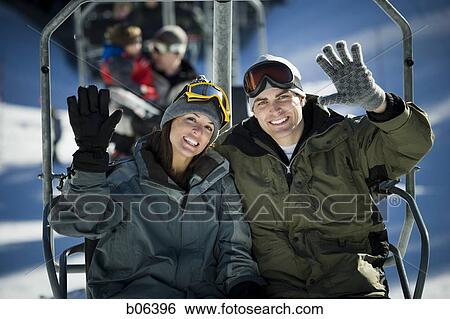 A couple on a chairlift View Large Photo Image Stock Photograph - A couple on a chairlift. Fotosearch