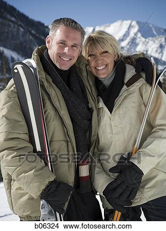 A couple outside in the snow View Large Photo Image Picture - A couple outside in the snow. Fotosearch