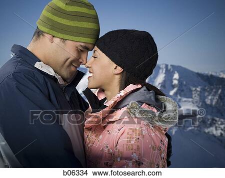 A couple outside in the snow View Large Photo Image Picture - A couple outside in the snow. Fotosearch