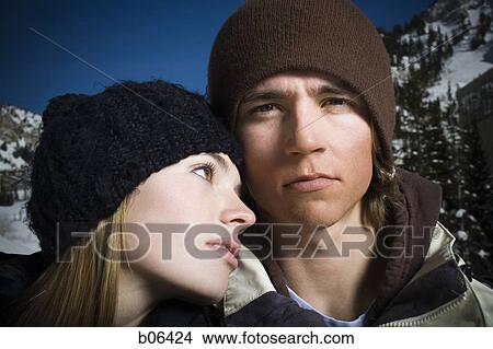 A couple outside in the snow View Large Photo Image Picture - A couple outside in the snow. Fotosearch