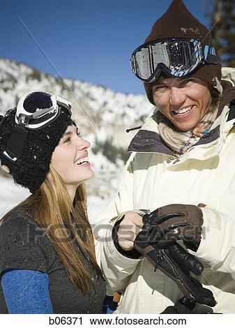A couple outside in the snow View Large Photo Image Stock Image - A couple outside in the snow. Fotosearch