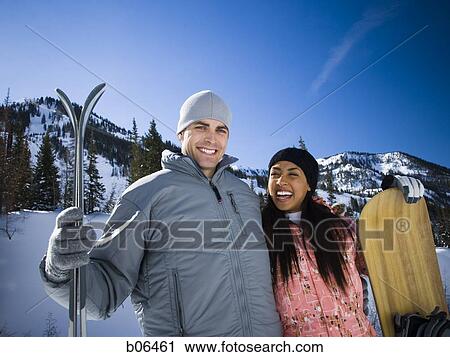 A couple outside in the snow View Large Photo Image Stock Image - A couple outside in the snow. Fotosearch