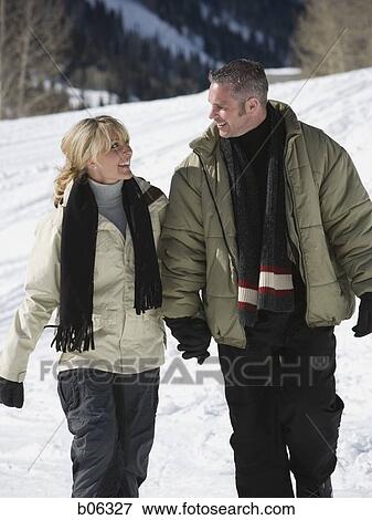 A couple outside in the snow View Large Photo Image Stock Photo - A couple outside in the snow. Fotosearch