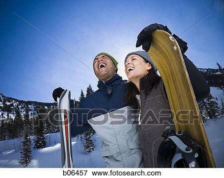 Stock Photo - A couple outside in the snow. Fotosearch
