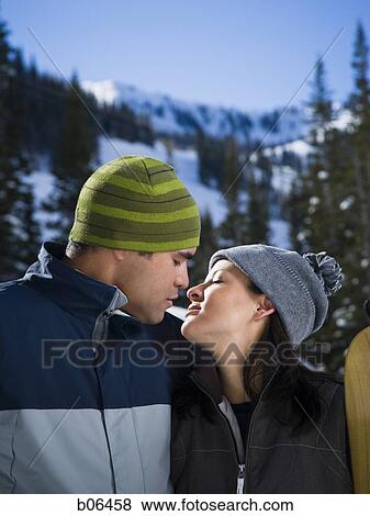A couple outside in the snow View Large Photo Image Stock Photo - A couple outside in the snow. Fotosearch