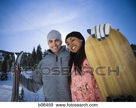 A couple outside in the snow View Large Photo Image Stock Photo - A couple outside in the snow. Fotosearch