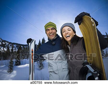 Stock Photography - A couple outside in the snow. Fotosearch
