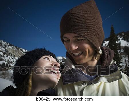 Stock Photography - A couple outside in the snow. Fotosearch