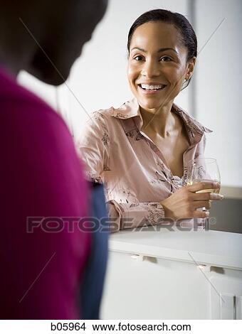 A couple with the woman drinking wine View Large Photo Image Picture - A couple with the woman drinking wine. Fotosearch