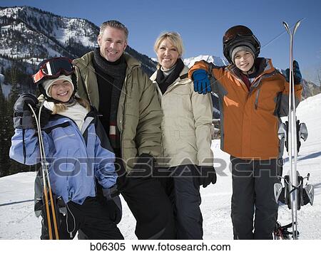 Stock Photography - A family on a snowy mountain. Fotosearch
