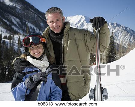 Stock Image - A father and his daughter outside in the snow. Fotosearch