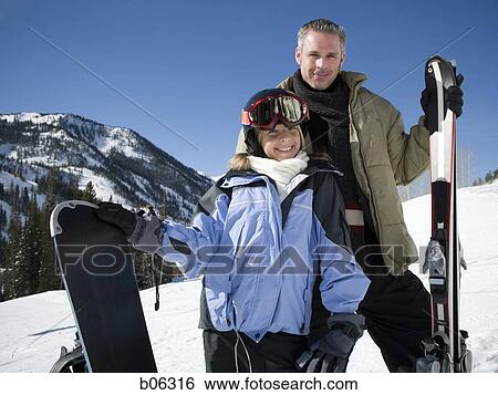 Stock Photograph - A father and his daughter outside in the snow. Fotosearch
