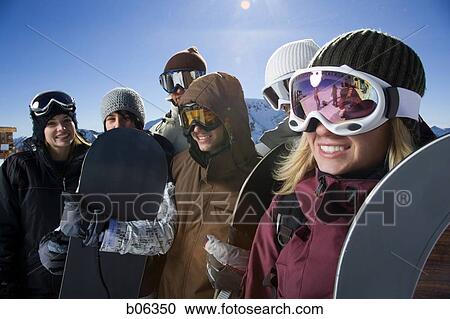 A group of friends outside in the snow View Large Photo Image Stock Image - A group of friends outside in the snow. Fotosearch
