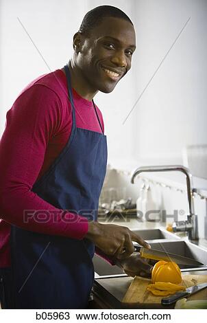 A man preparing food View Large Photo Image Stock Image - A man preparing food. Fotosearch