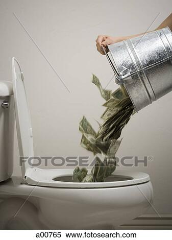 A person pouring a bucket of money down the toilet View Large Photo Image Stock Photography - A person pouring a bucket of money down the toilet. Fotosearch
