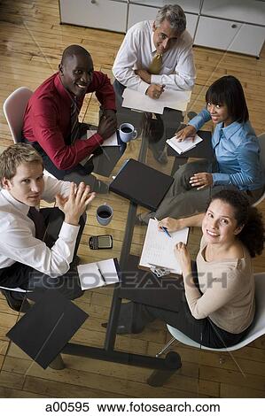Aerial view of business meeting with five people View Large Photo Image Stock Photography - Aerial view of business meeting with five people. Fotosearch