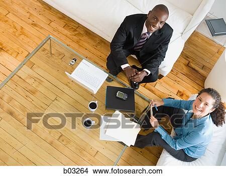 An informal meeting with a man and woman View Large Photo Image Picture - An informal meeting with a man and woman. Fotosearch