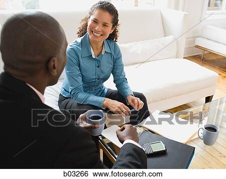 Stock Photograph - An informal meeting with a man and woman. Fotosearch