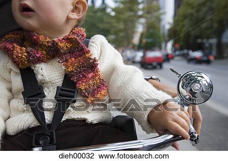 Stock Image - Baby on bicycle. Fotosearch
