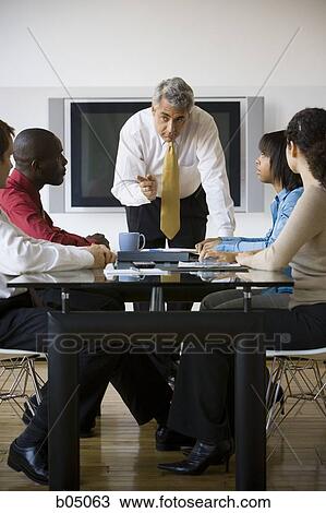 Boss pointing at business meeting View Large Photo Image Stock Image - Boss pointing at business meeting. Fotosearch