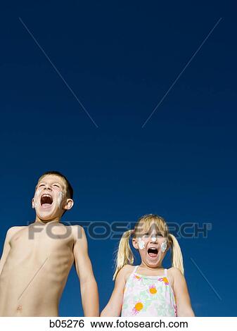 Boy and girl with sunscreen shouting View Large Photo Image Stock Photograph - Boy and girl with sunscreen shouting. Fotosearch