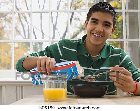 Boy eating breakfast View Large Photo Image Stock Photo - Boy eating breakfast. Fotosearch