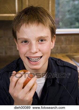 Stock Photo - Boy eating. Fotosearch