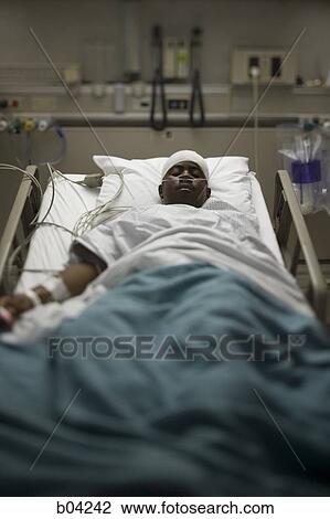 Boy in hospital bed with head bandages View Large Photo Image Stock Image - Boy in hospital bed with head bandages. Fotosearch
