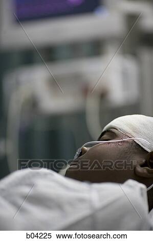 Boy in hospital bed with head bandages View Large Photo Image Stock Photography - Boy in hospital bed with head bandages. Fotosearch