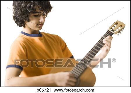 Boy playing the guitar View Large Photo Image Stock Image - Boy playing the guitar. Fotosearch