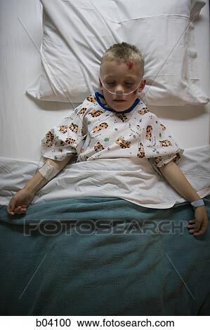 Boy sleeping in hospital bed View Large Photo Image Stock Image - Boy sleeping in hospital bed. Fotosearch