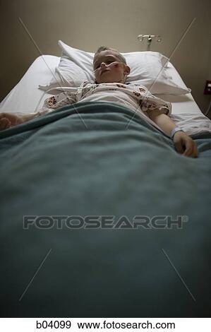 Boy sleeping in hospital bed View Large Photo Image Stock Photo - Boy sleeping in hospital bed. Fotosearch