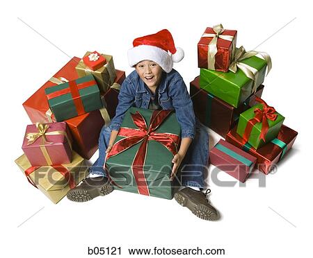 Boy with Christmas gifts View Large Photo Image Stock Image - Boy with Christmas gifts. Fotosearch